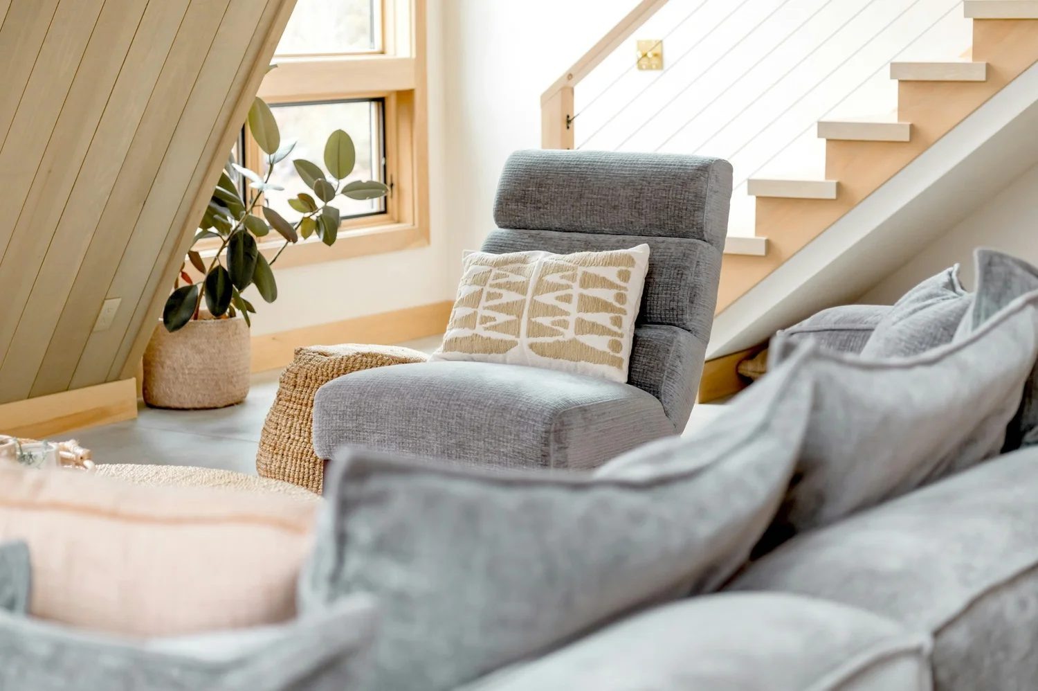 Cosy sofa corner with blanket and warm light